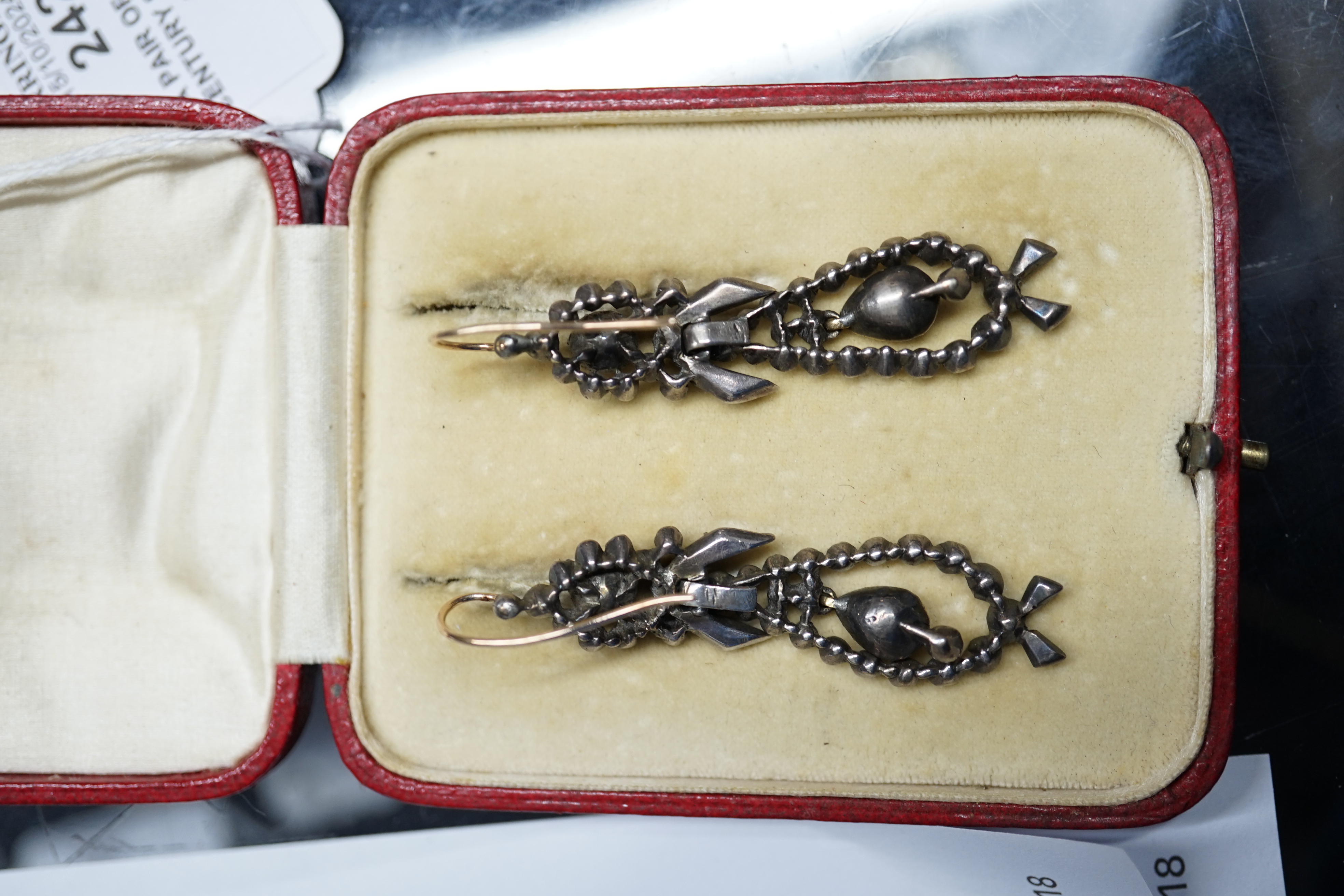 A pair of early 19th century silver, foil backed quartz and flat cut diamond set articulated drop earrings